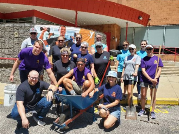 A group of volunteers outside with shovels